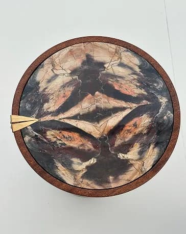 Overhead view of a circular jasper mosaic tabletop.